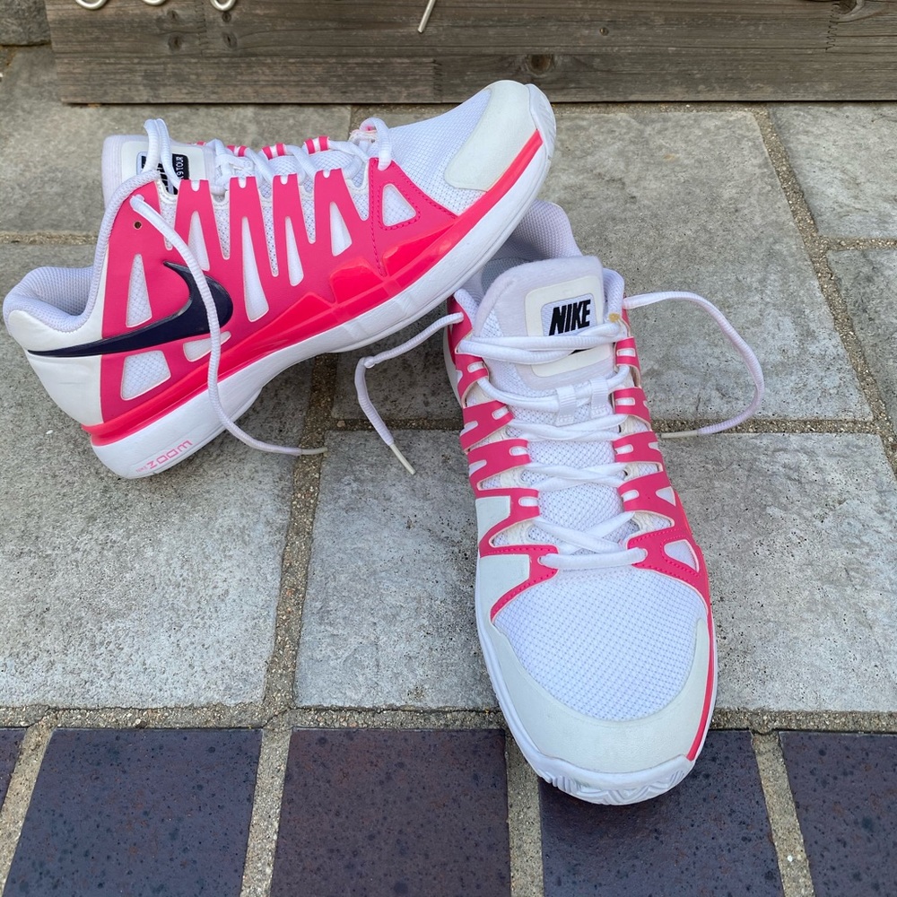 White pink and black Nike tennis shoes